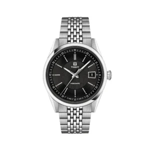 Reloj clásico Tissot Heritage Visodate automático con esfera negra de textura cepillada vertical, ventana de fecha a las 3 y brazalete de acero de malla milanesa fina.